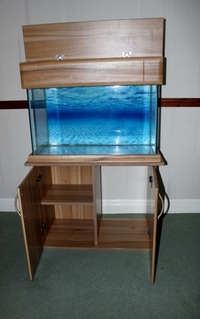 For sale -- £175 - 120l Aquarium in wooden display cabinet complete set up.